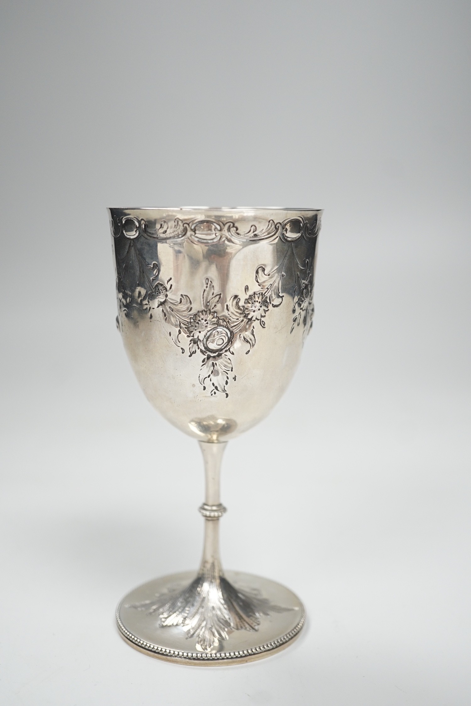 A Victorian embossed silver goblet by Charles Stuart Harris, London, 1875, 14.2cm, 3.3oz.